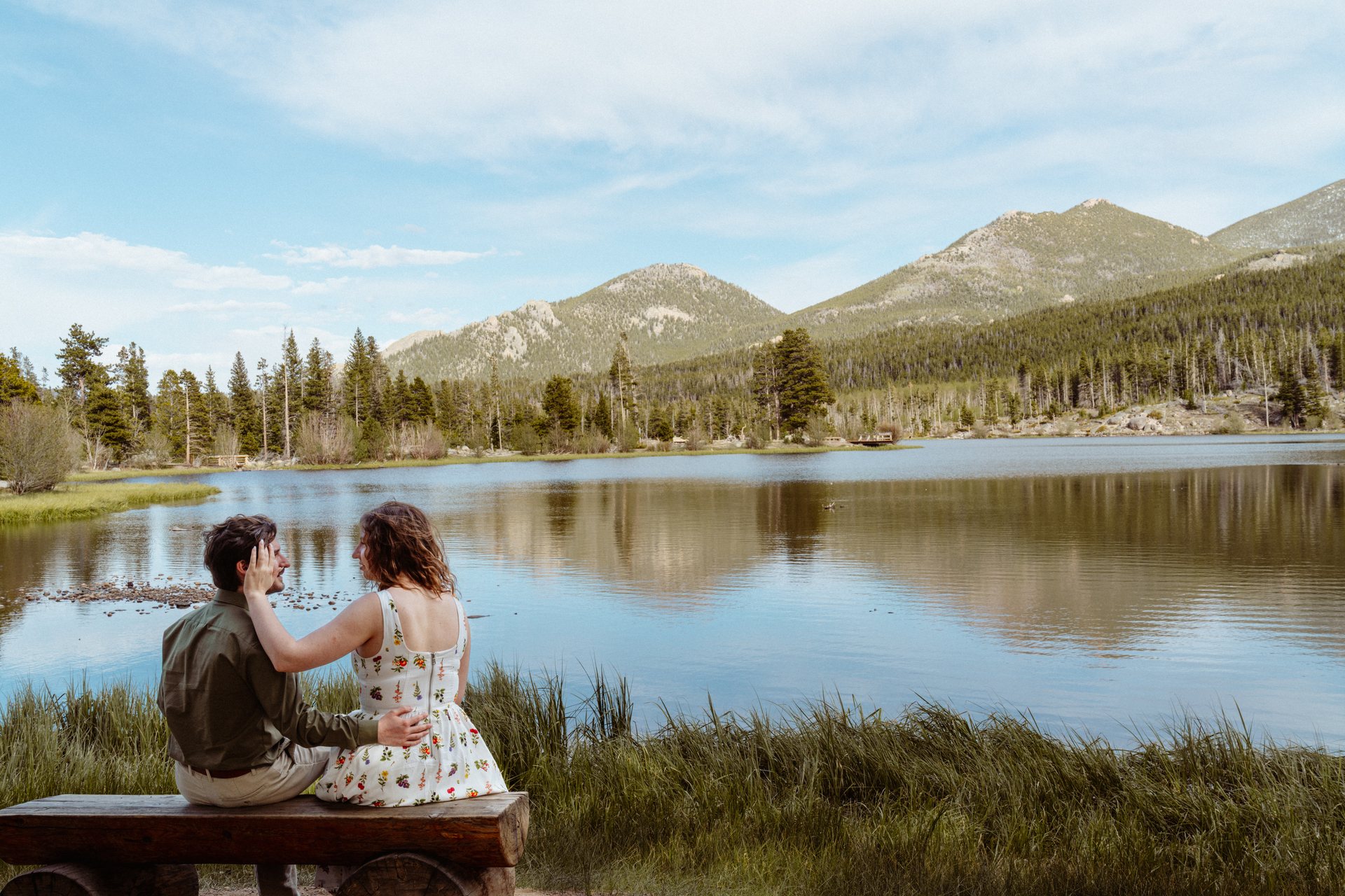 Bride and groom embracing in a mountain meadow, Motus elopement in Rocky Mountain National Park