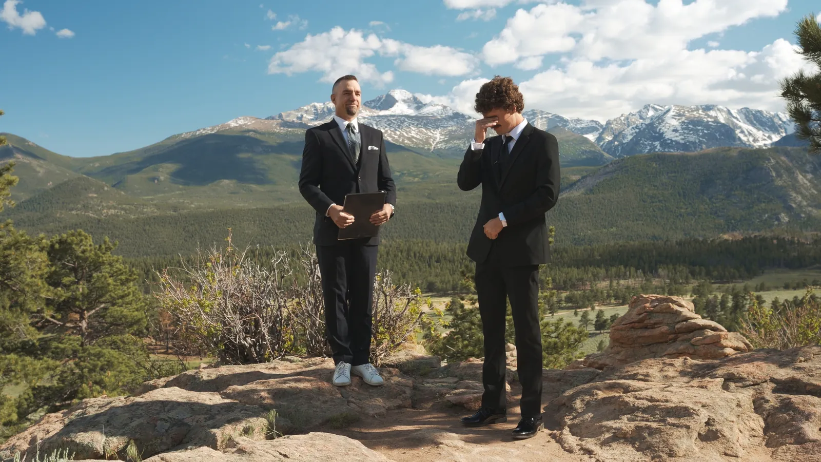 Groom tearing up at an overlook ceremony, still from a Motus wedding film, Rocky Mountain National Park