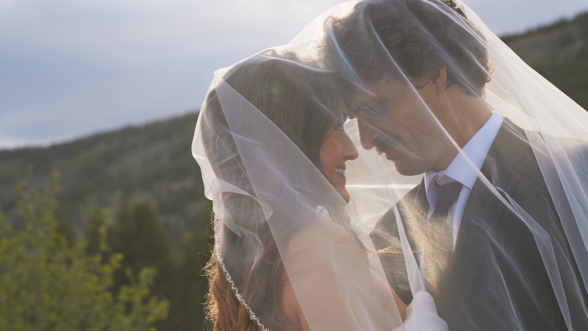 Bride and groom under the veil, still from a Motus wedding film, Rocky Mountain National Park