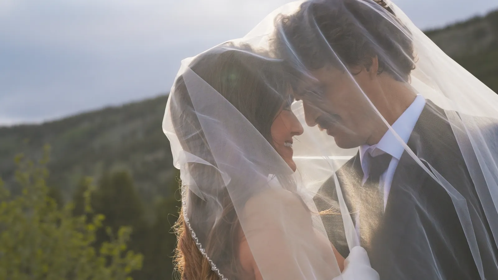 Bride and groom under the veil, still from a Motus wedding film, Rocky Mountain National Park